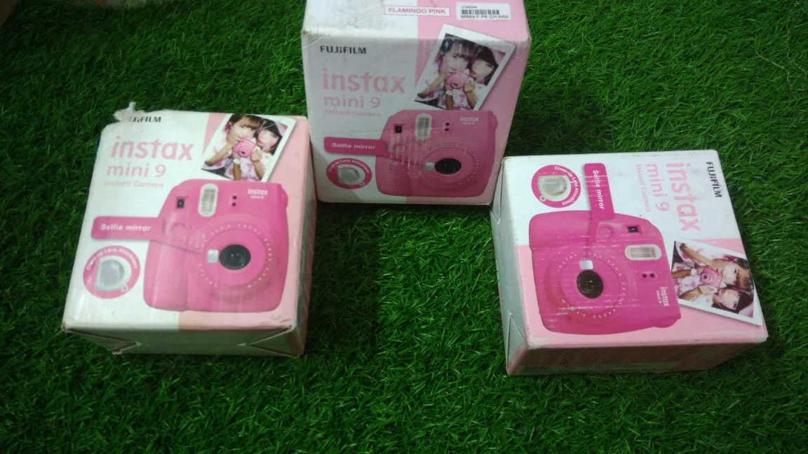 Fujifilm Instax Mini 9 Instant Camera - Flamingo Pink in use