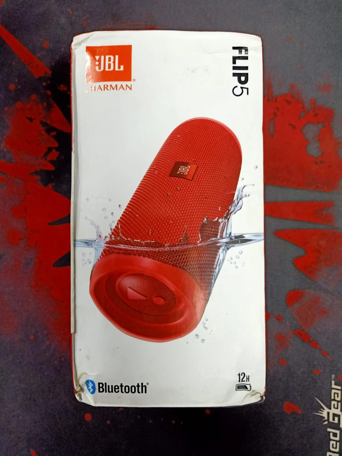 JBL Flip 5 Wireless Portable Bluetooth Speaker in use