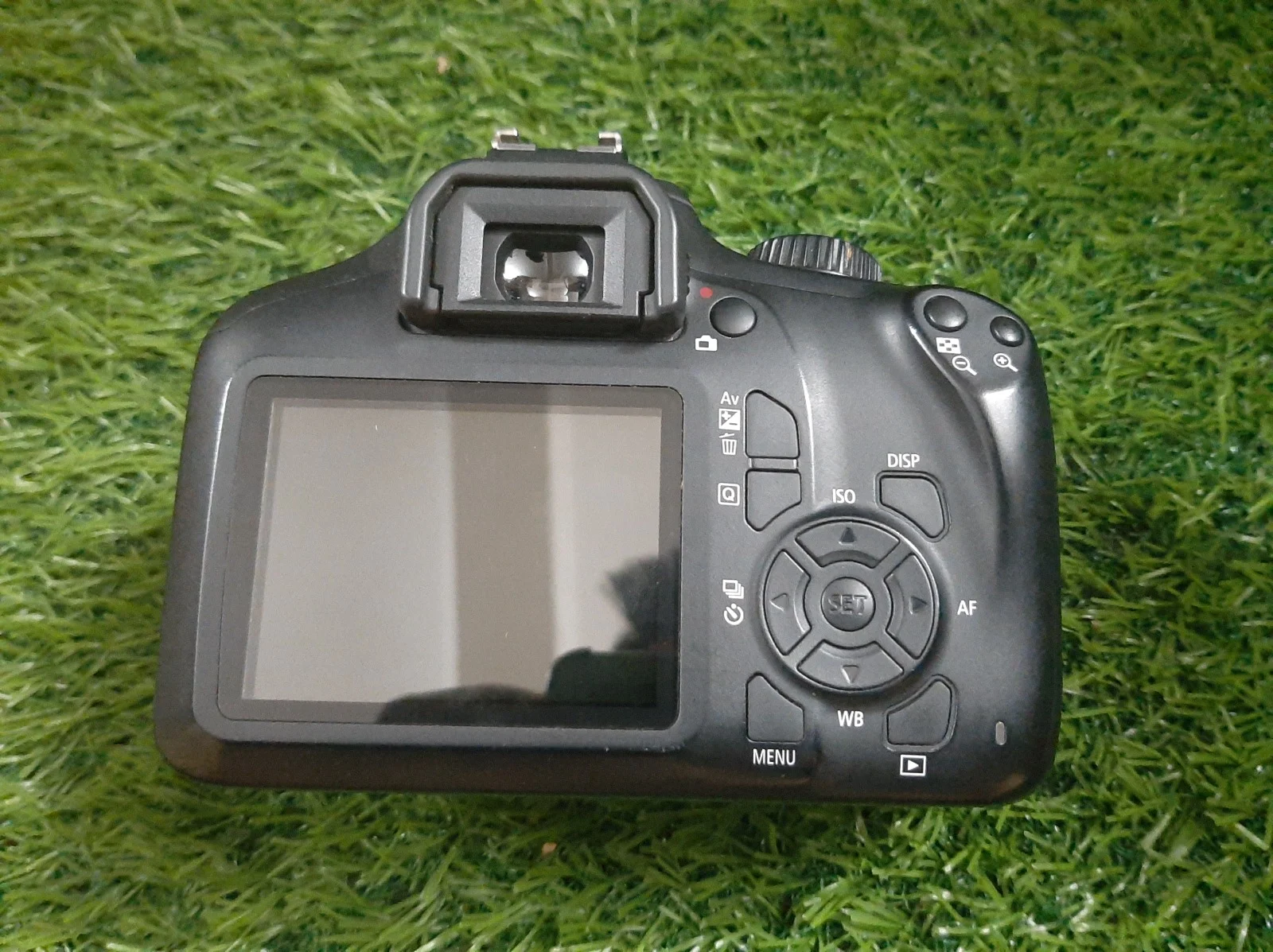 Canon EOS 3000D 18MP DSLR Camera with 18-55mm IS II Lens in use