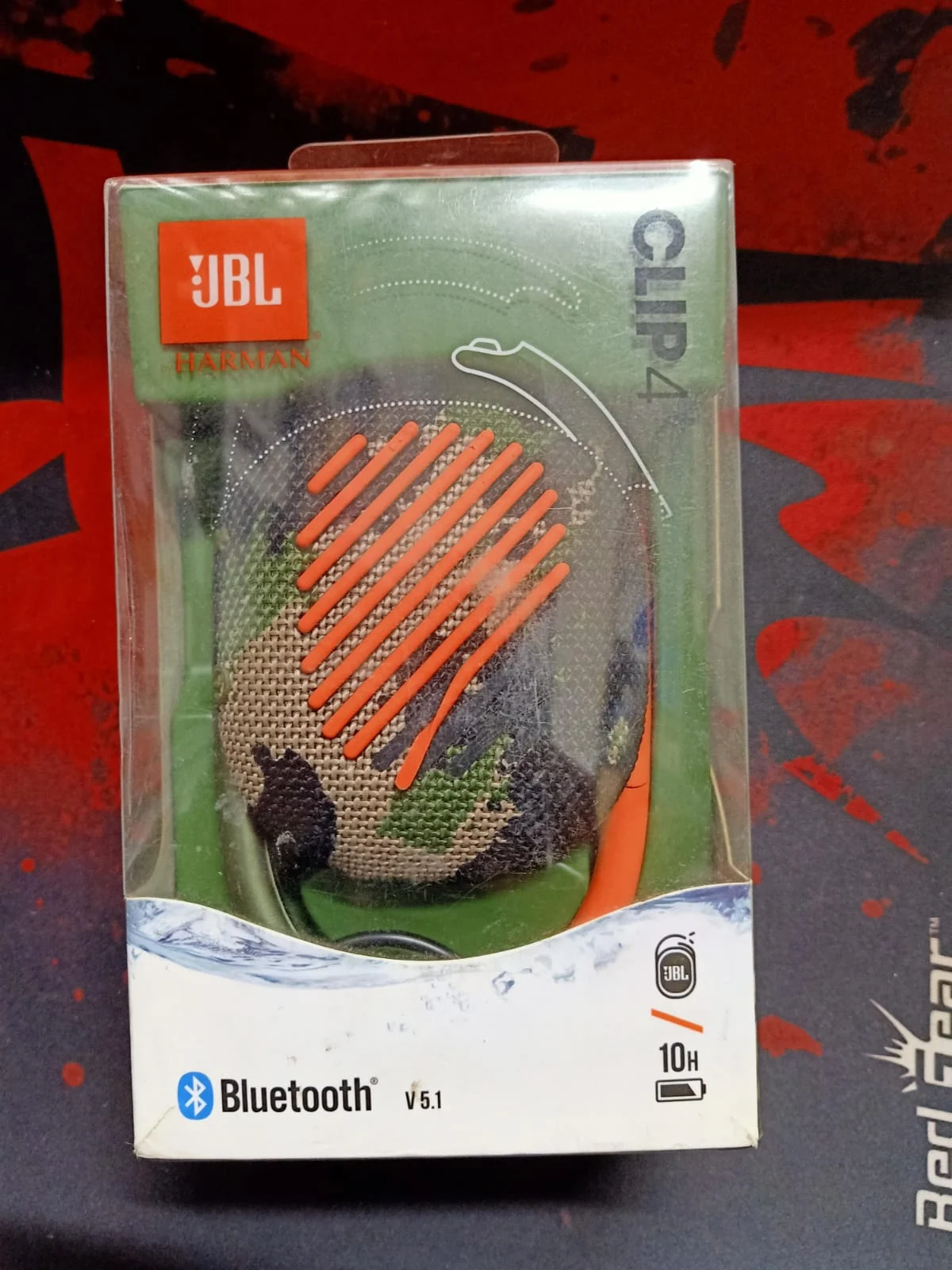 JBL Clip 4 Portable Mini Bluetooth Speaker Squad in use